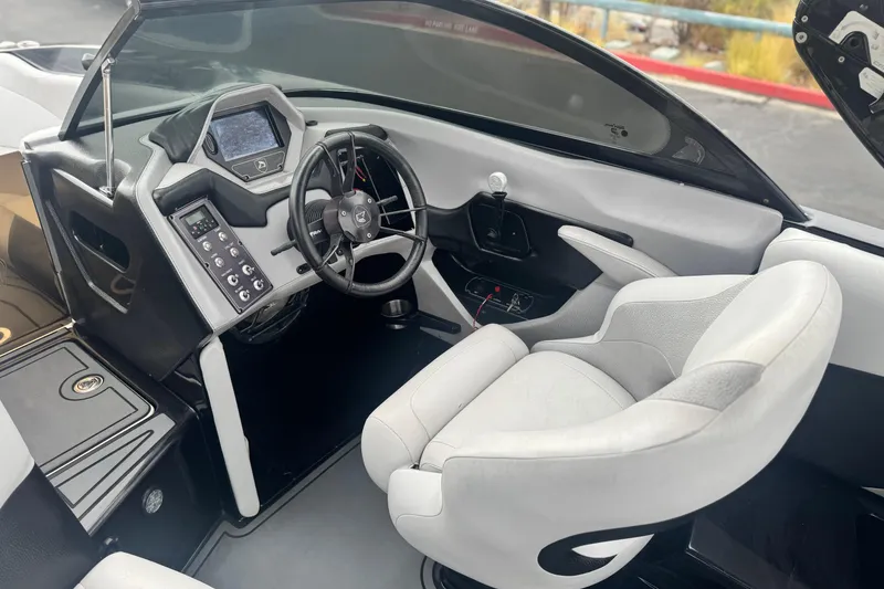 Slide: The Image of 2015 Centurion Enzo FS44 boat interior with modern dashboard and steering wheel. - 33