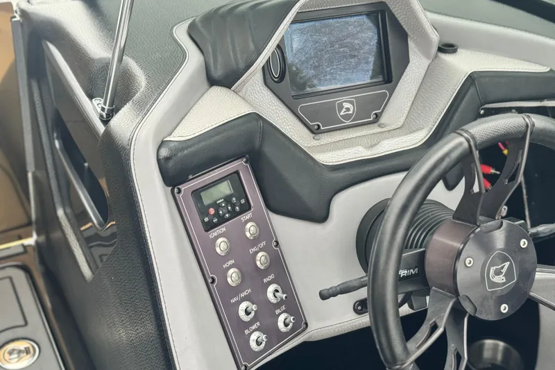 Slide: The Image of Dashboard of a 2015 Centurion Enzo FS44 boat with steering wheel and control panel. - 34