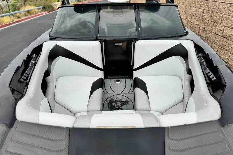 Slide: The Image of 2015 Centurion Enzo FS44 boat interior with sleek black and white seating design. - 9