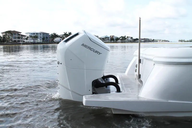 Slide: The Image of 2024 Intrepid 41 Valor boat with Mercury outboard engine on calm water. - 10