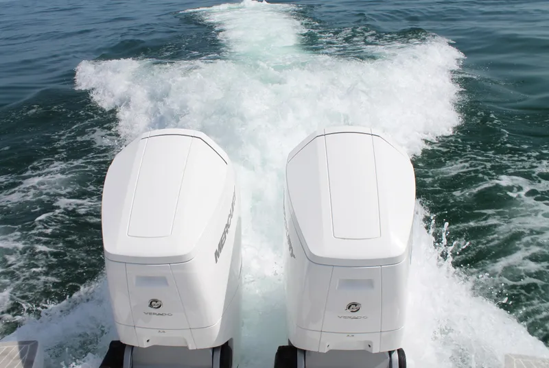 Slide: The Image of 2024 Intrepid 41 Valor boat with dual outboard engines on open water. - 12