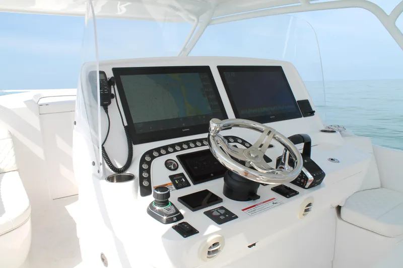 Slide: The Image of 2024 Intrepid 41 Valor helm with dual screens and modern controls. - 20