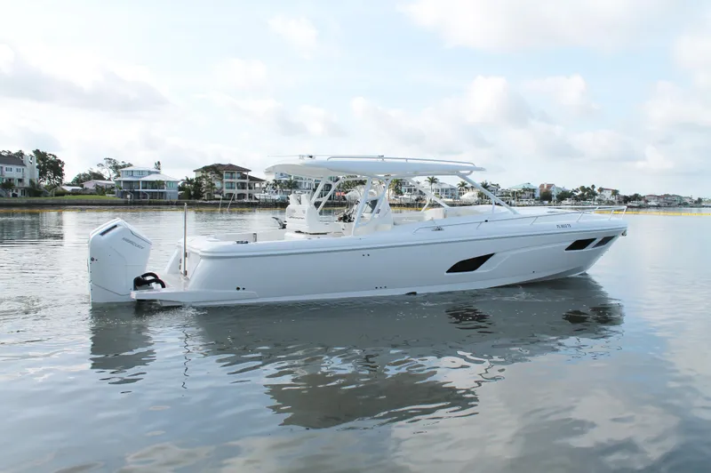 Slide: The Image of 2024 Intrepid 41 Valor boat on calm water, showcasing sleek design and modern features. - 3