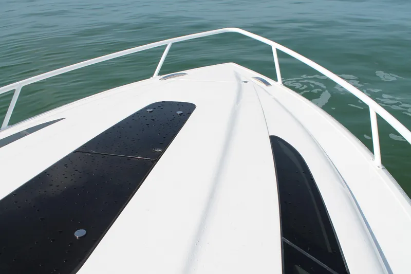 Slide: The Image of Bow view of 2024 Intrepid 41 Valor boat on calm water. - 34