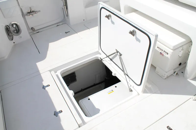 Slide: The Image of 2024 Intrepid 41 Valor boat deck with open storage compartment. - 37