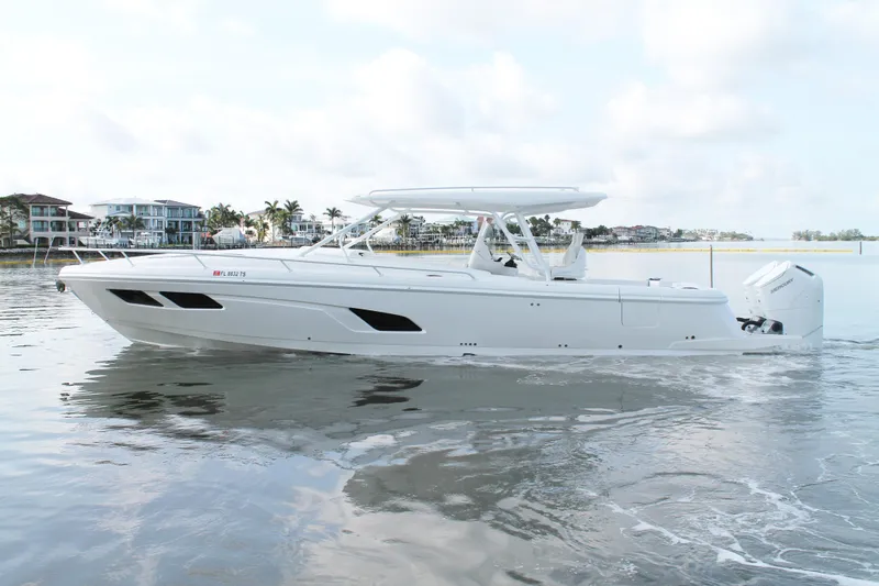 Slide: The Image of 2024 Intrepid 41 Valor boat on calm water, showcasing sleek design and modern features. - 6