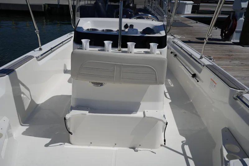 Slide: The Image of 2025 Boston Whaler 170 Montauk boat interior with seating and rod holders. - 21
