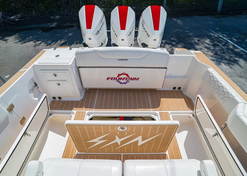 Slide: The Image of 2024 Fountain 32 NX boat interior with triple engines and sleek design. - 12