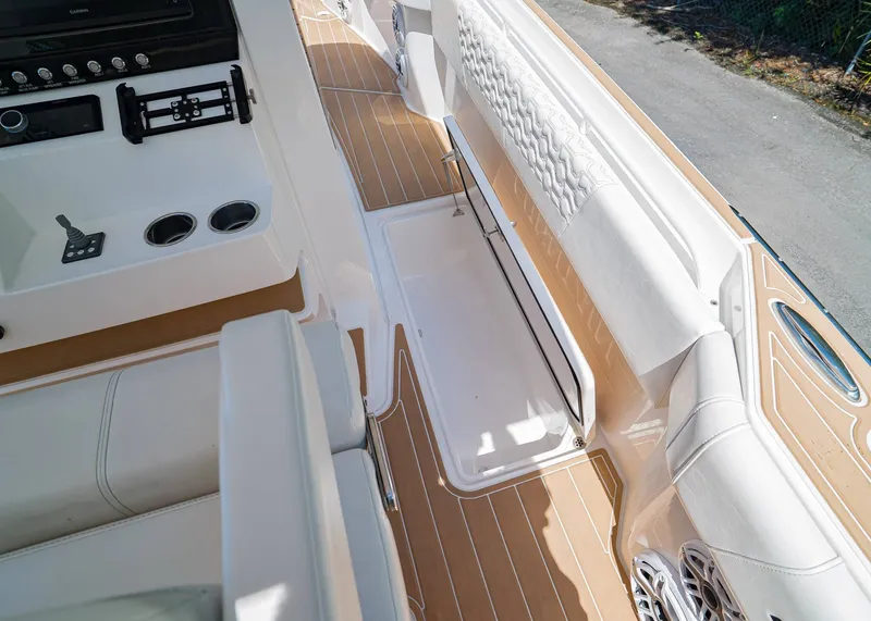 Slide: The Image of 2024 Fountain 32 NX boat interior with sleek seating and modern controls. - 15