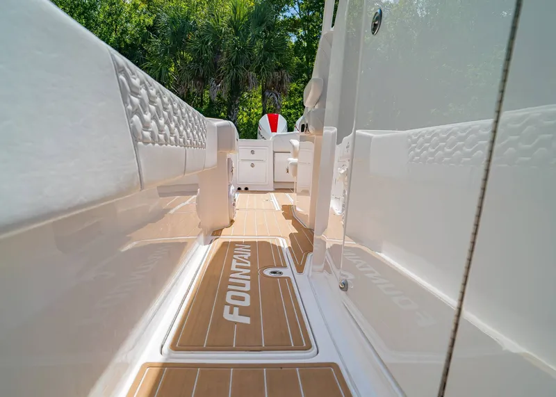 Slide: The Image of 2024 Fountain 32 NX boat interior with sleek design and wood-textured flooring. - 18