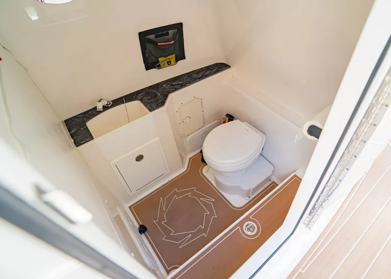 Slide: The Image of 2024 Fountain 32 NX boat bathroom with sink and toilet. - 28
