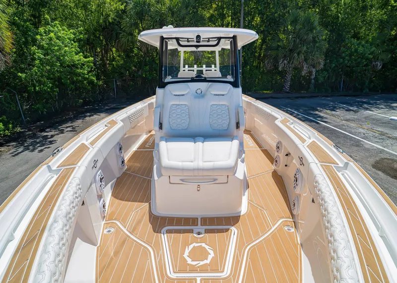 Slide: The Image of 2024 Fountain 32 NX boat with luxurious seating and sleek design. - 32