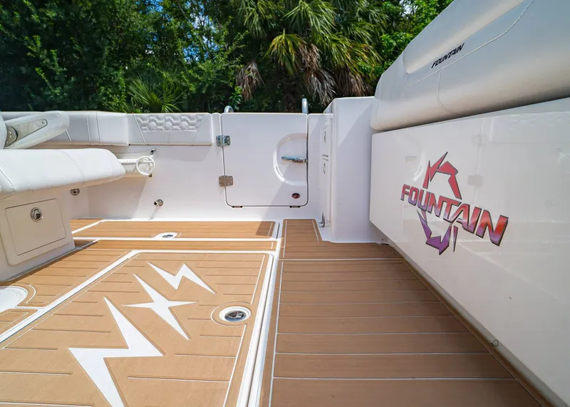Slide: The Image of 2024 Fountain 32 NX boat interior with sleek design and wood-patterned flooring. - 7
