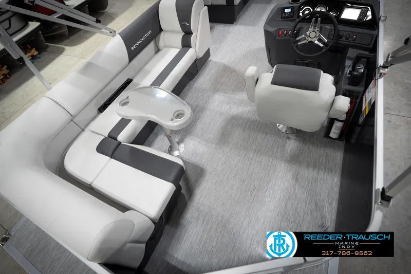 Slide: The Image of 2026 Bennington 20 SL pontoon boat interior with plush seating and modern helm. - 14