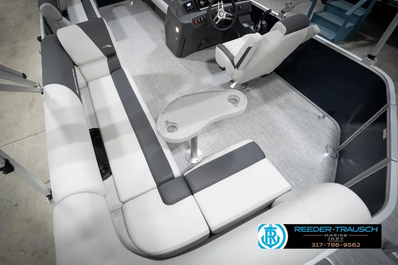 Slide: The Image of Interior view of 2026 Bennington 20 SL pontoon boat with seating and steering console. - 15