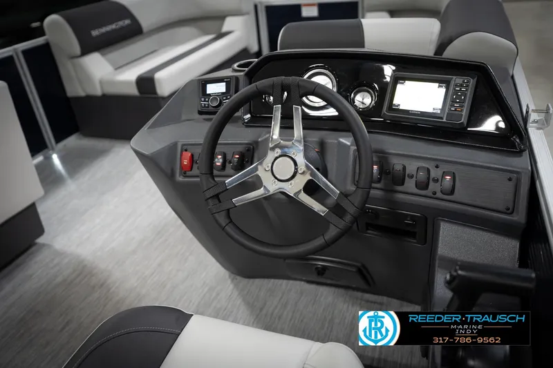 Slide: The Image of 2026 Bennington 20 SL boat dashboard with steering wheel and control panel. - 31