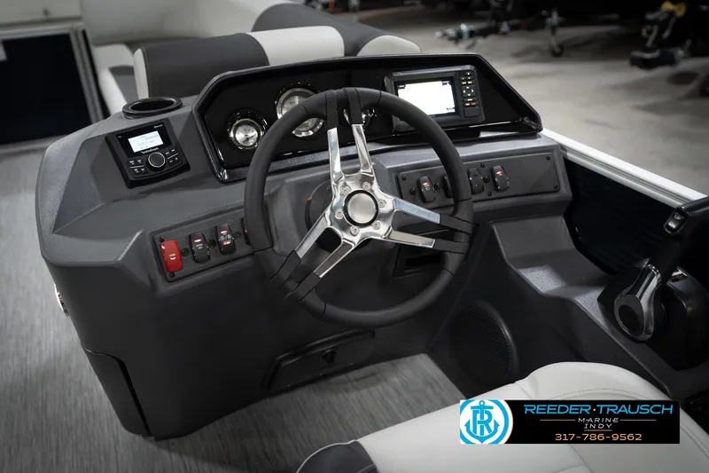 Slide: The Image of 2026 Bennington 20 SL boat dashboard with steering wheel and control panel. - 32
