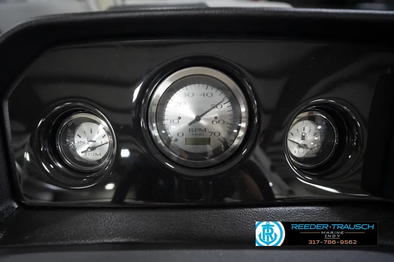 Slide: The Image of Dashboard gauges of 2026 Bennington 20 SL boat, featuring RPM, trim, and fuel indicators. - 36