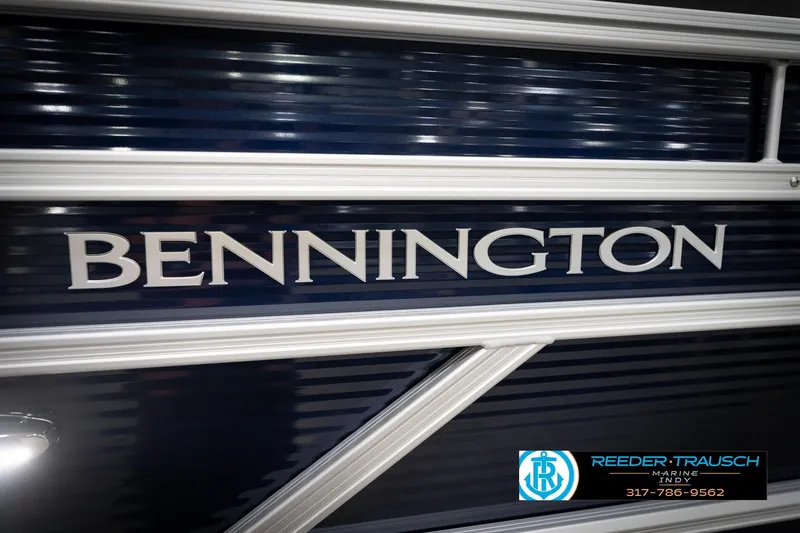 Slide: The Image of 2026 Bennington 20 SL boat with sleek design and Reeder-Trausch Marine logo. - 49