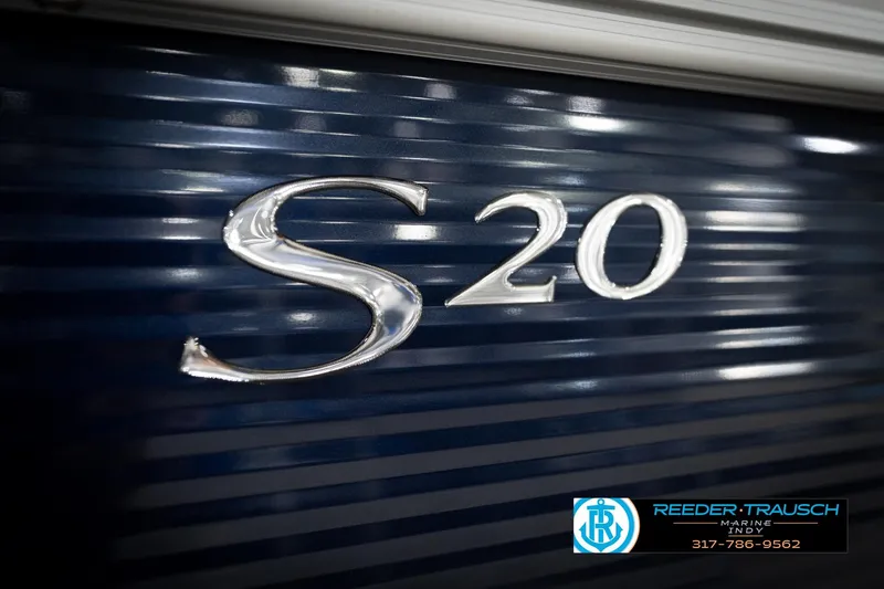 Slide: The Image of 2026 Bennington 20 SL boat emblem on dark blue background. - 50