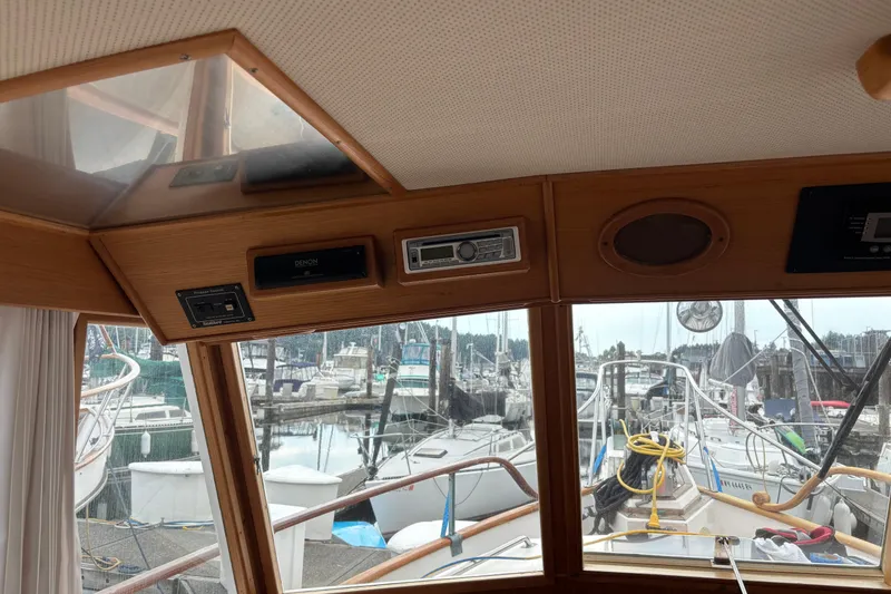 Slide: The Image of Interior view of a 1991 Grand Banks 36 Classic yacht with marina in background. - 10