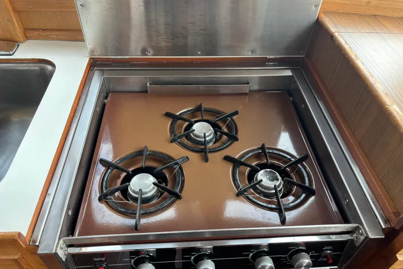 Slide: The Image of Three-burner stove in 1991 Grand Banks 36 Classic yacht kitchen. - 11
