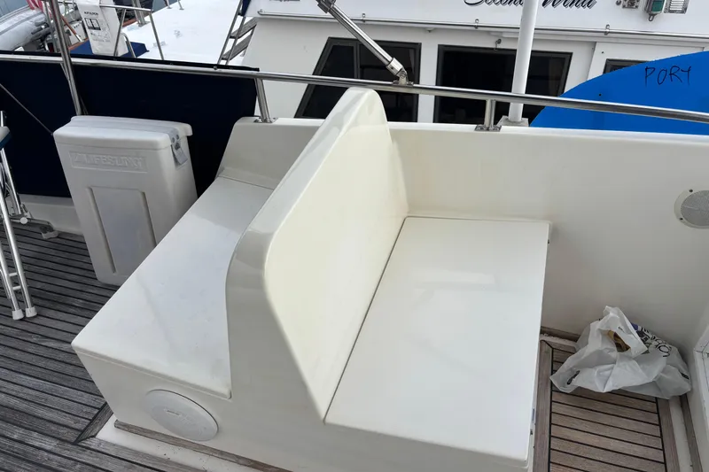 Slide: The Image of 1991 Grand Banks 36 Classic boat deck with seating and storage. - 4