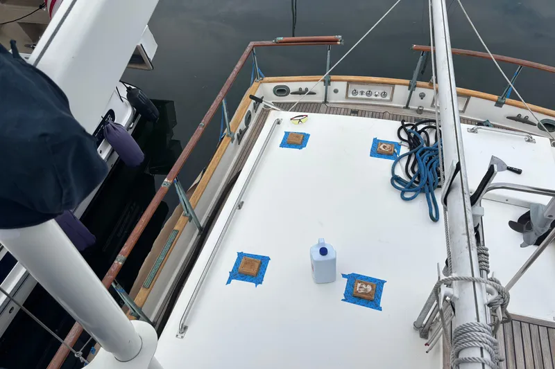 Slide: The Image of Deck of a 1991 Grand Banks 36 Classic yacht with ropes and maintenance items. - 5