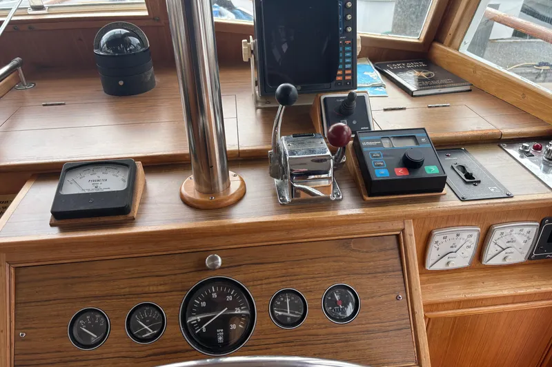 Slide: The Image of Helm of 1991 Grand Banks 36 Classic with navigation instruments and controls. - 8