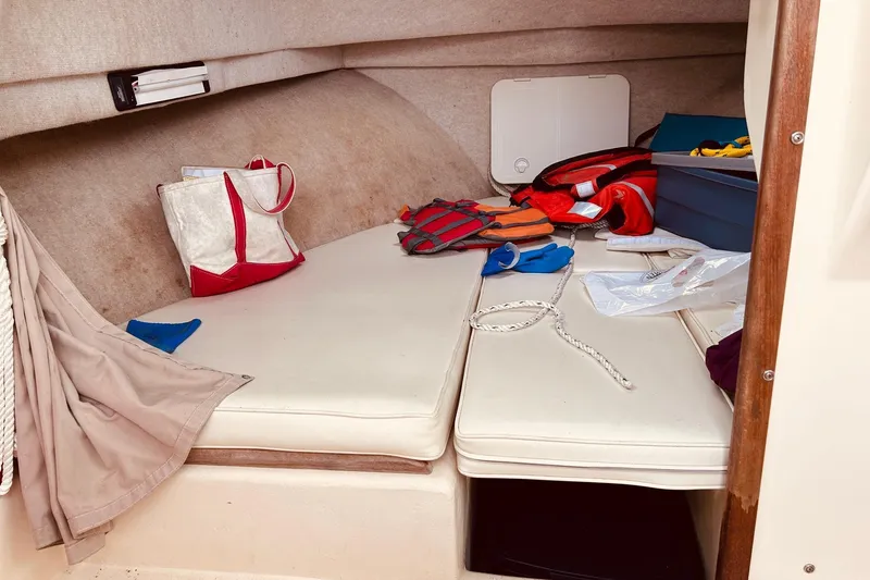 Slide: The Image of Interior cabin of 2001 Parker 2520 Deep Vee Sport, with life jackets and gear. - 14