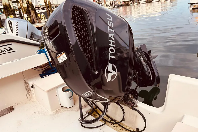 Slide: The Image of Tohatsu 250 outboard motor on a 2001 Parker 2520 Deep Vee Sport Cabin boat. - 9