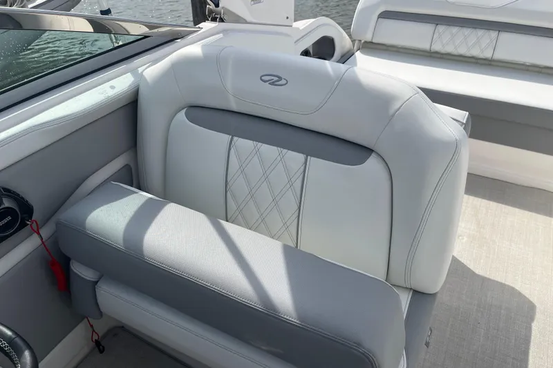 Slide: The Image of 2023 Regal 28 Express boat interior with luxurious seating and elegant design. - 17