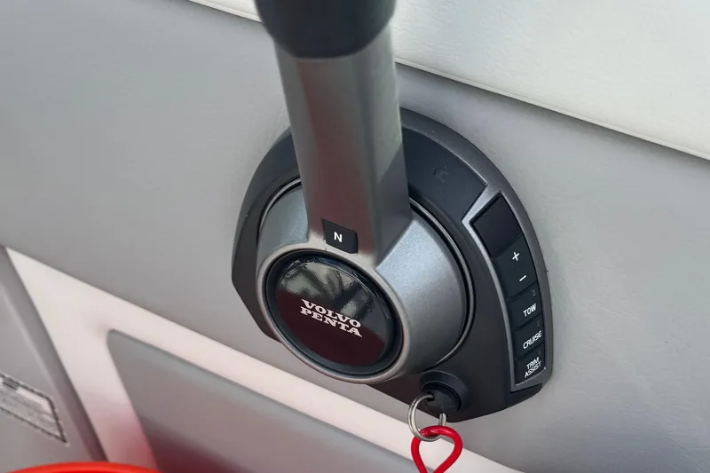 Slide: The Image of Throttle control of 2023 Regal 28 Express boat with Volvo Penta branding. - 22