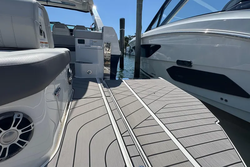 Slide: The Image of 2023 Sea Ray SLX 400 Outboard boat deck with luxurious seating and modern design. - 10