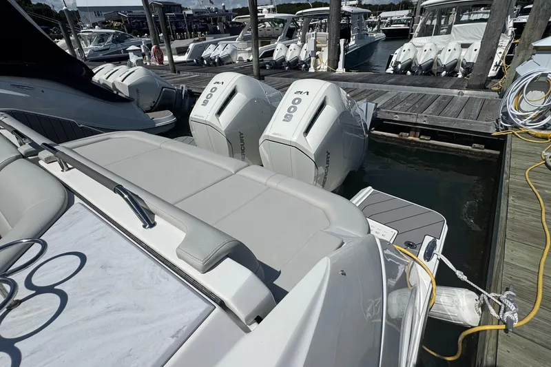Slide: The Image of 2023 Sea Ray SLX 400 Outboard with powerful Mercury engines docked at marina. - 11