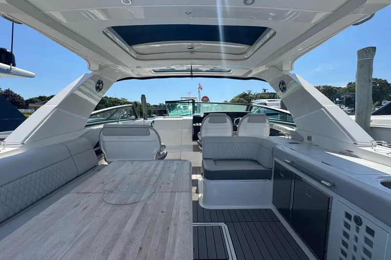 Slide: The Image of Luxurious interior of 2023 Sea Ray SLX 400 Outboard, featuring spacious seating and modern amenities. - 16