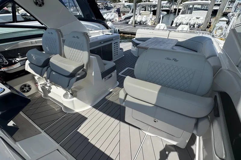 Slide: The Image of 2023 Sea Ray SLX 400 Outboard interior with luxurious seating and modern design. - 22