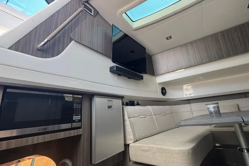 Slide: The Image of Luxurious interior of 2023 Sea Ray SLX 400 Outboard with modern amenities. - 31