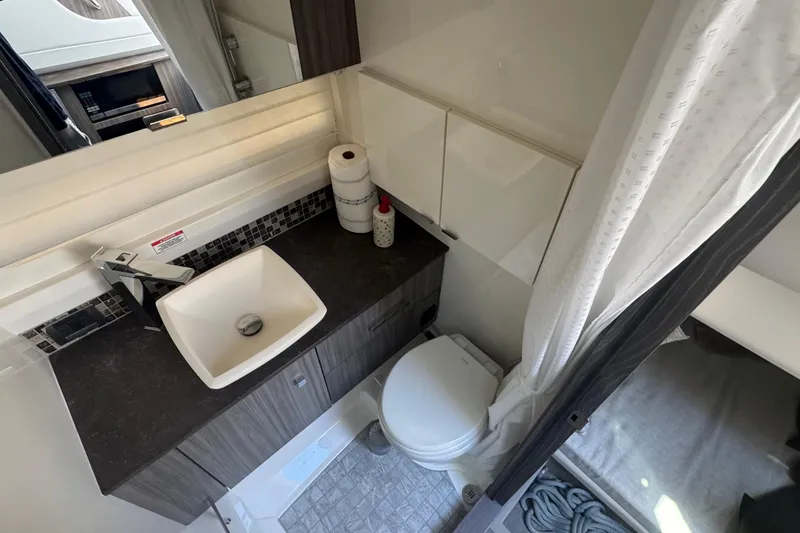 Slide: The Image of Modern bathroom in 2023 Sea Ray SLX 400 Outboard boat with sink and toilet. - 33