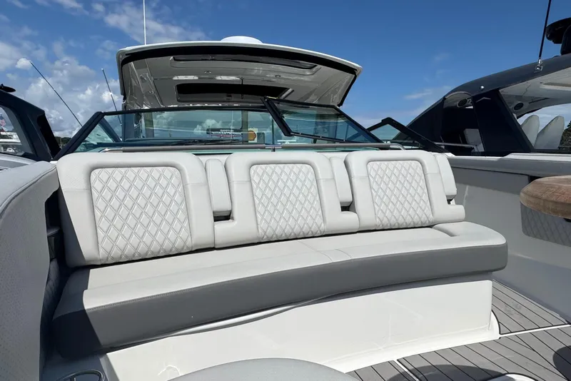 Slide: The Image of 2023 Sea Ray SLX 400 Outboard boat interior with luxurious seating and modern design. - 39