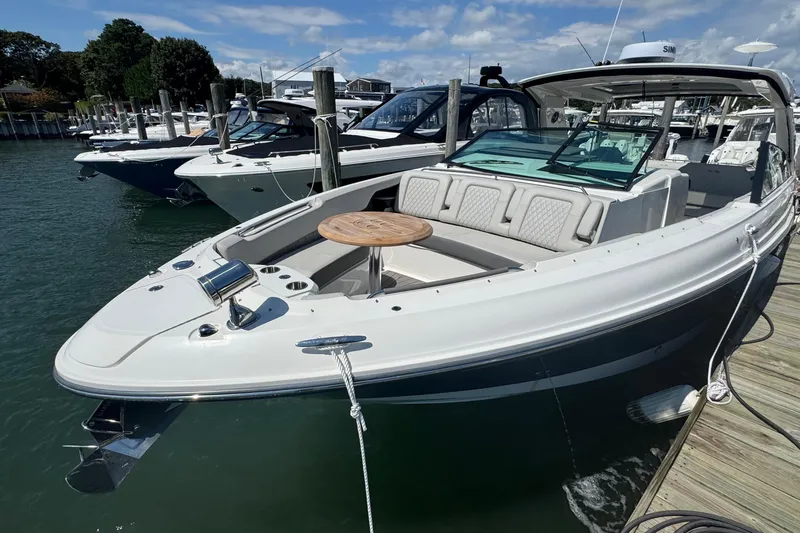 Slide: The Image of 2023 Sea Ray SLX 400 Outboard docked, featuring spacious seating and sleek design. - 41