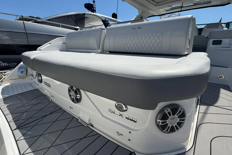 Slide: The Image of 2023 Sea Ray SLX 400 Outboard boat with luxurious seating and modern design. - 8