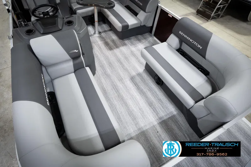 Slide: The Image of 2026 Bennington 168 SLJ boat interior with gray seating and steering console. - 13