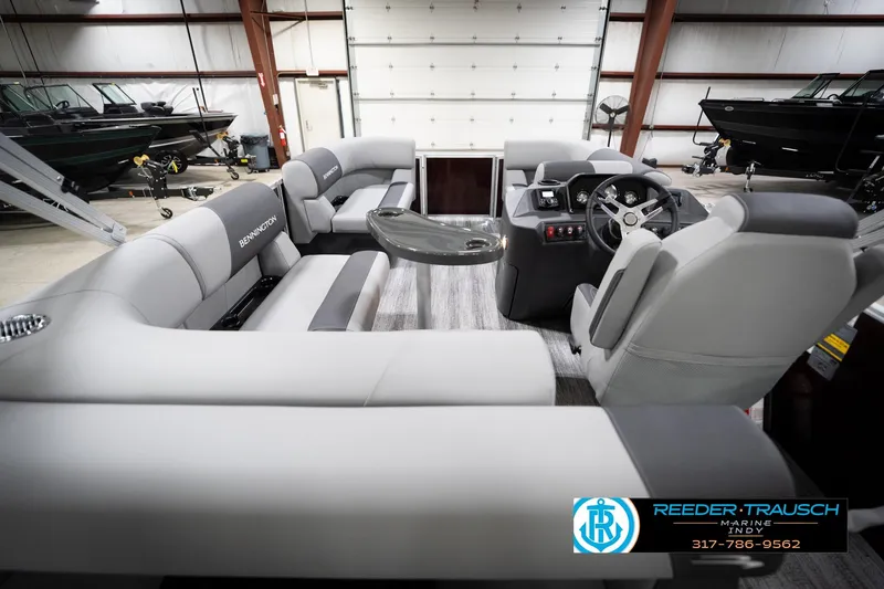 Slide: The Image of 2026 Bennington 168 SLJ pontoon boat interior with plush seating and modern helm. - 18