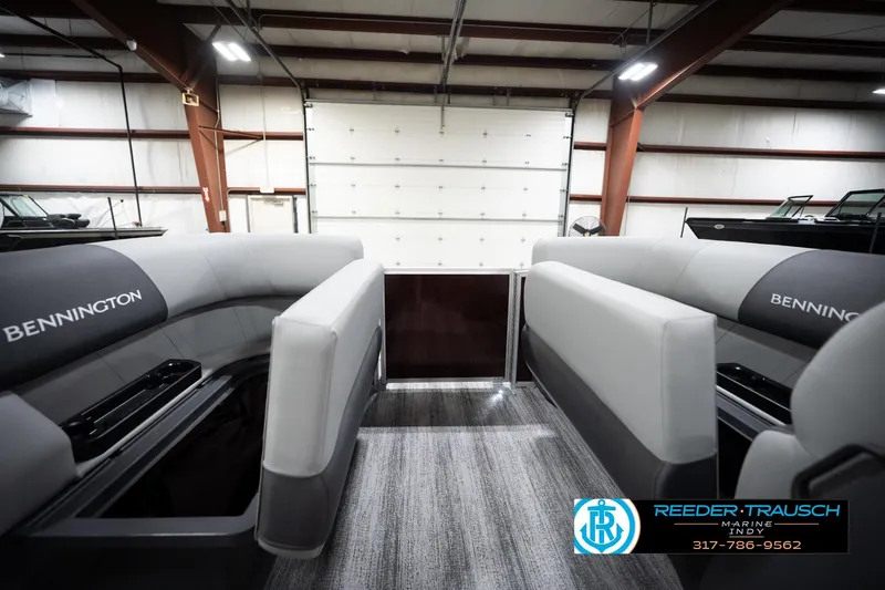 Slide: The Image of 2026 Bennington 168 SLJ boat interior with gray seating in a showroom. - 20