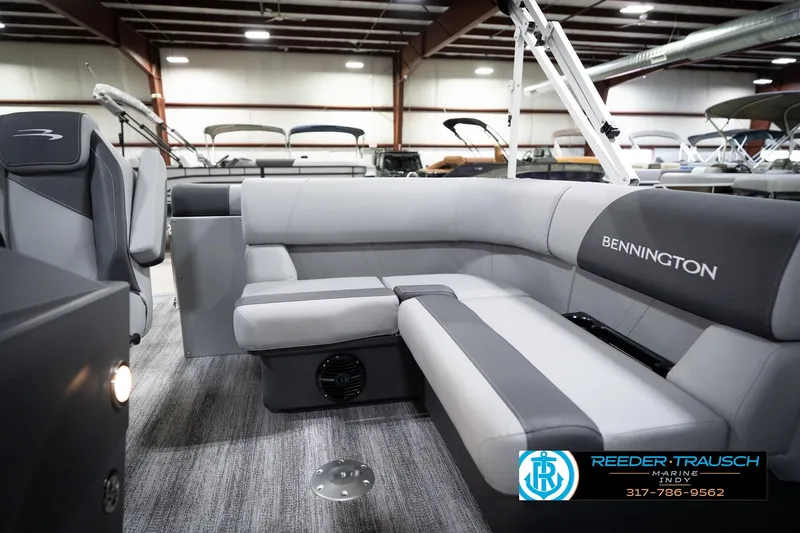 Slide: The Image of 2026 Bennington 168 SLJ pontoon boat interior with gray seating in showroom. - 22