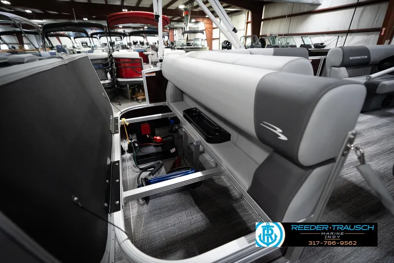 Slide: The Image of 2026 Bennington 168 SLJ boat interior with open storage compartment, displayed at Reeder-Trausch Marine. - 28