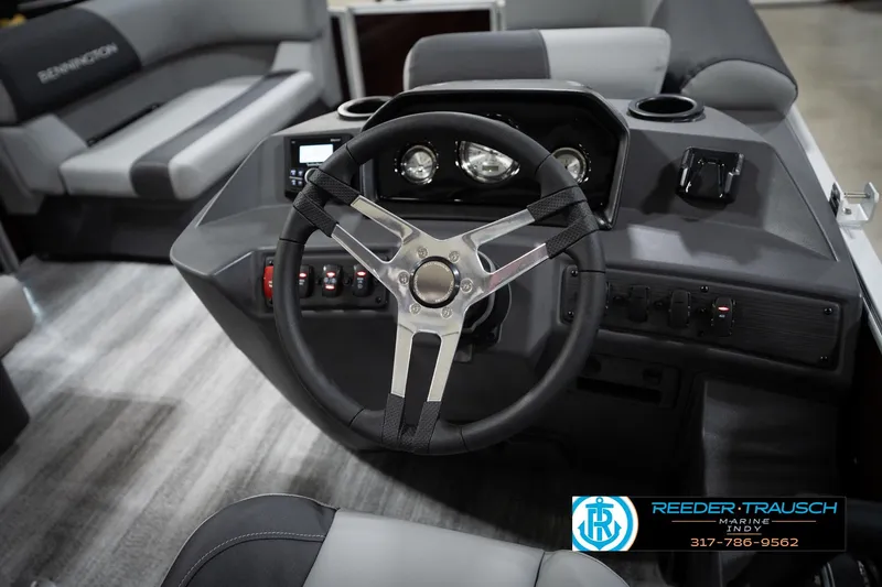 Slide: The Image of 2026 Bennington 168 SLJ boat interior with steering wheel and dashboard controls. - 29