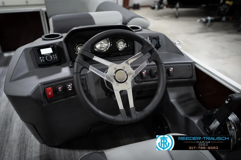 Slide: The Image of 2026 Bennington 168 SLJ boat dashboard with steering wheel and control panel. - 30