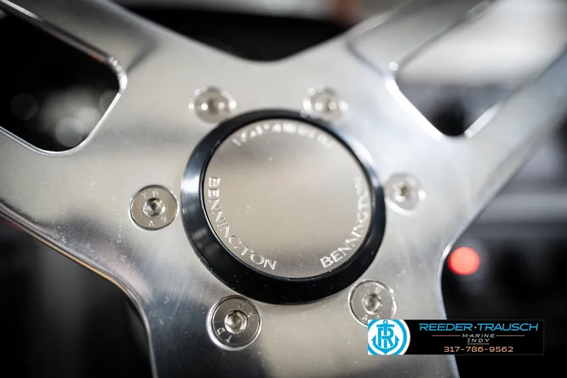 Slide: The Image of Close-up of 2026 Bennington 168 SLJ steering wheel with logo and metallic finish. - 31